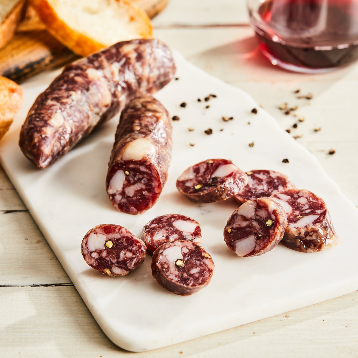Image of Genoa salami. 1 link, 3oz. a classic Italian pork salami made with garlic, white wine, fennel seed, and black pepper